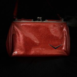 Lux De Ville sparkling red purse with silver, kiss lock closure